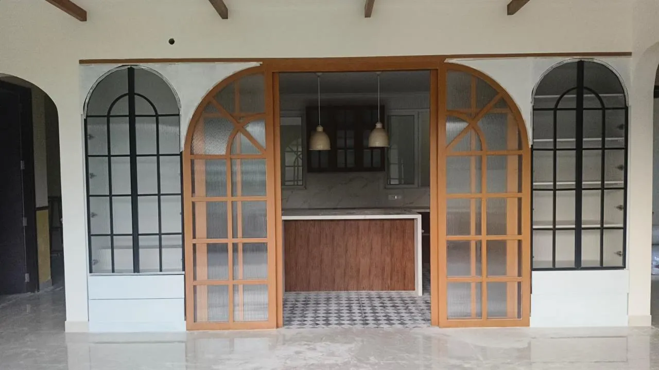 Freshly cleaned kitchen with glass-fronted cabinet doors after a deep clean
