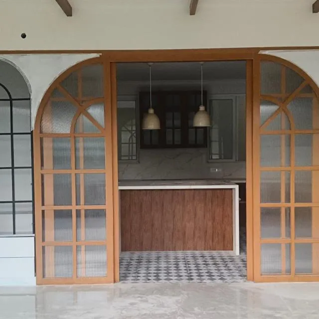 Kitchen with arched wooden glass doors and display units after new interior cleaning