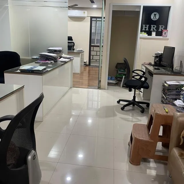 Office with glass cabins and shining tiled floor